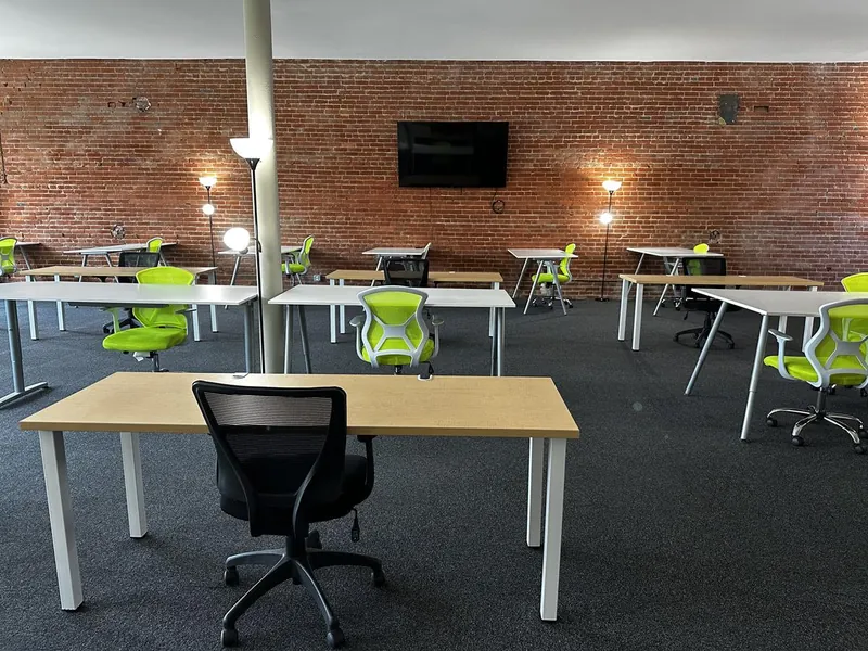 Open desks and chairs on the DTX WRX coworking floor