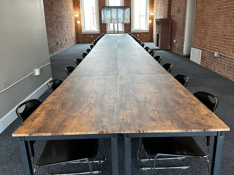 The Founders Conference Room set with a long table for forty